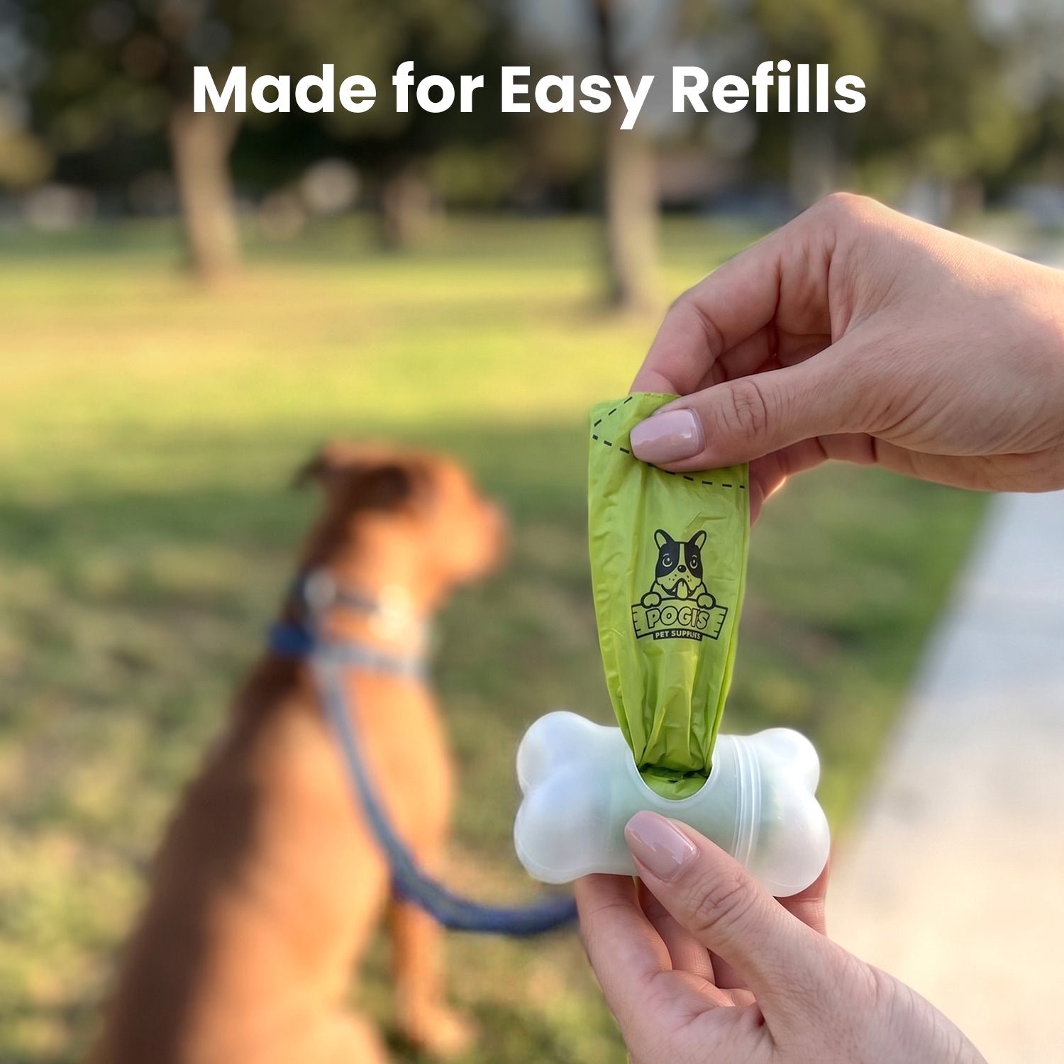 Made for easy refills: loading a Pogi's poop bag roll into the bone-shaped leash dispenser at the park